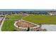 Aerial view of a new construction neighborhood with walking paths, green spaces, and community areas at 9886 Ceylon Ct, Commerce City, CO 80022