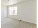 Bright bedroom with a large window that provides great neighborhood views at 9886 Ceylon Ct, Commerce City, CO 80022