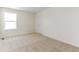 This bedroom features a light colored carpet and a window allowing lots of natural light at 9886 Ceylon Ct, Commerce City, CO 80022