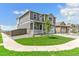 Two-story home boasts a well-manicured lawn and inviting front porch at 9886 Ceylon Ct, Commerce City, CO 80022