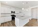 Kitchen with stainless steel appliances and granite island at 9886 Ceylon Ct, Commerce City, CO 80022