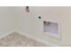 The laundry area features tile flooring and hookups for a washer and dryer at 9886 Ceylon Ct, Commerce City, CO 80022