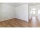 A bright living room showcases wood flooring and a neutral palette at 9886 Ceylon Ct, Commerce City, CO 80022