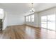 Bright and airy living room area with natural light and sliding glass doors at 9886 Ceylon Ct, Commerce City, CO 80022