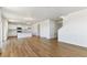 Bright, open-concept living space with modern floors and access to the kitchen at 9886 Ceylon Ct, Commerce City, CO 80022