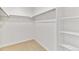 This walk-in closet offers ample storage with shelving and a hanging rod at 9886 Ceylon Ct, Commerce City, CO 80022