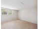 Bedroom with neutral carpet, large window, light wallpaper and closet at 7190 S Poplar Ct, Centennial, CO 80112