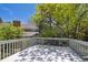 Deck showcases a white railing with views of a landscaped yard and mature trees at 7190 S Poplar Ct, Centennial, CO 80112
