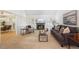 Cozy living room with fireplace, neutral decor, and comfortable seating at 7190 S Poplar Ct, Centennial, CO 80112