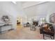 Open-concept living room with vaulted ceilings, fireplace, and stylish furnishings at 7190 S Poplar Ct, Centennial, CO 80112