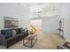 Bright and airy living room with view of entryway, neutral decor, and tall ceilings at 7190 S Poplar Ct, Centennial, CO 80112