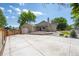 Large backyard featuring a spacious concrete patio, deck and synthetic lawn at 12665 Grove Ct, Broomfield, CO 80020