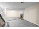 Finished basement with neutral paint and plush carpeting surrounding a brick fireplace at 12665 Grove Ct, Broomfield, CO 80020