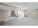 Large finished basement with stairs, a storage closet, and a window for natural light at 12665 Grove Ct, Broomfield, CO 80020