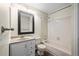 Cozy bathroom featuring a shower over tub, modern vanity and large mirror at 12665 Grove Ct, Broomfield, CO 80020