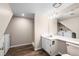 Small, updated bathroom with modern vanity, wood-look floor, and walk-in shower at 12665 Grove Ct, Broomfield, CO 80020