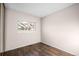 Comfortable bedroom featuring hardwood floors and a large window at 12665 Grove Ct, Broomfield, CO 80020