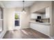 Dining area featuring an eat in bar, lots of light and wood floors at 12665 Grove Ct, Broomfield, CO 80020