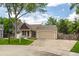 Charming single-story home with a well-maintained lawn and a two-car attached garage at 12665 Grove Ct, Broomfield, CO 80020