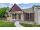 Inviting front porch and meticulously maintained lawn and landscape at 12665 Grove Ct, Broomfield, CO 80020