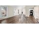Spacious living area with hardwood floors, large windows, and view into the kitchen at 12665 Grove Ct, Broomfield, CO 80020