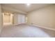 Spacious basement area featuring neutral carpet, base trim, and ample natural light from adjacent rooms at 6727 W Yale Ave, Lakewood, CO 80227