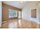 Bright room with hardwood floors, ceiling fan, and vaulted ceiling at 6727 W Yale Ave, Lakewood, CO 80227