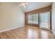 Sunlit room with hardwood floors, neutral walls, and a ceiling fan at 6727 W Yale Ave, Lakewood, CO 80227