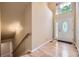 Bright foyer with hardwood floors and a decorative glass door at 6727 W Yale Ave, Lakewood, CO 80227