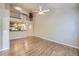 Spacious living room featuring hardwood floors and a kitchen view at 6727 W Yale Ave, Lakewood, CO 80227