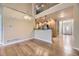 Open floorplan with hardwood floors connecting living room to kitchen at 6727 W Yale Ave, Lakewood, CO 80227