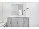 Modern bathroom boasts a vanity with cabinet storage, sleek fixtures, and a large mirror at 5688 N Killarney Ct, Aurora, CO 80019
