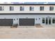 Apartment building featuring individual garages and unit numbers at 5688 N Killarney Ct, Aurora, CO 80019