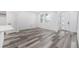 Bright living room with wood flooring, white walls, and modern windows, creating a clean and inviting space at 5688 N Killarney Ct, Aurora, CO 80019