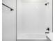 Walk-in shower features sleek white subway tile and modern matte black hardware at 5688 N Killarney Ct, Aurora, CO 80019