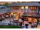 Overhead shot of home exterior featuring spacious deck with pergola and outdoor seating at 7678 Newman St, Arvada, CO 80005