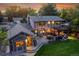 An aerial view of a property, showcasing the backyard with a deck, pergola, and expansive lawn at 7678 Newman St, Arvada, CO 80005
