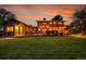 A spacious backyard features a pergola, outdoor seating, and a large lawn for relaxation and entertainment at 7678 Newman St, Arvada, CO 80005