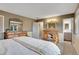 Cozy bedroom with neutral tones showcasing built-in wooden storage and providing ample space and a relaxing atmosphere at 7678 Newman St, Arvada, CO 80005