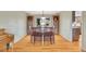 Charming dining room with wood table set, hardwood floors, and built-in cabinets at 7678 Newman St, Arvada, CO 80005