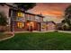 Beautiful two-story house with brick accents, lush lawn, and a welcoming front entrance at 7678 Newman St, Arvada, CO 80005