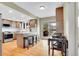 Bright kitchen with stainless steel appliances, granite countertops, and a breakfast bar at 7678 Newman St, Arvada, CO 80005