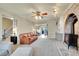 Inviting living room with brick fireplace, comfortable seating, and open access to other rooms at 7678 Newman St, Arvada, CO 80005