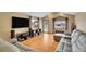 Spacious living room with hardwood floors, vaulted ceiling, and comfortable seating arrangement at 7678 Newman St, Arvada, CO 80005