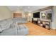 Large living room with hardwood floors, high ceilings, and lots of room for entertaining at 7678 Newman St, Arvada, CO 80005