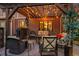 Inviting outdoor patio space featuring a pergola with string lights and comfortable seating arrangements at 7678 Newman St, Arvada, CO 80005