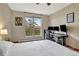 Bright bedroom features a large window and a dedicated workspace for a comfortable and productive environment at 3058 Bergen Point Trl, Evergreen, CO 80439