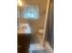 Compact bathroom with a granite vanity and shower with curtain at 14751 E 24Th Ave, Aurora, CO 80011