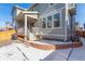 Backyard exterior featuring siding, a patio and BBQ, windows, brickwork, and a small patch of snow at 17470 E 95Th Pl, Commerce City, CO 80022