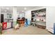 This finished basement is great for entertaining with open space and built in shelving at 17470 E 95Th Pl, Commerce City, CO 80022